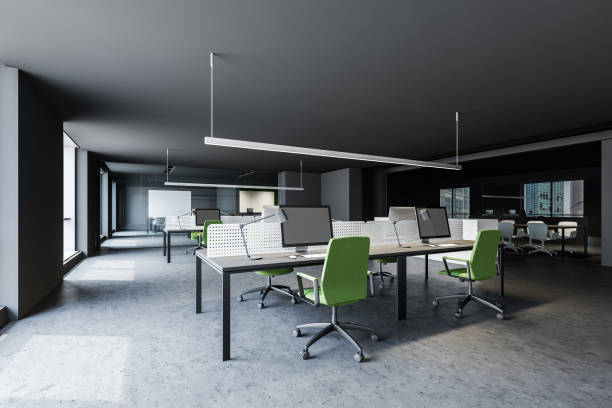 istock Gray office with green chairs and meeting room 1200583513