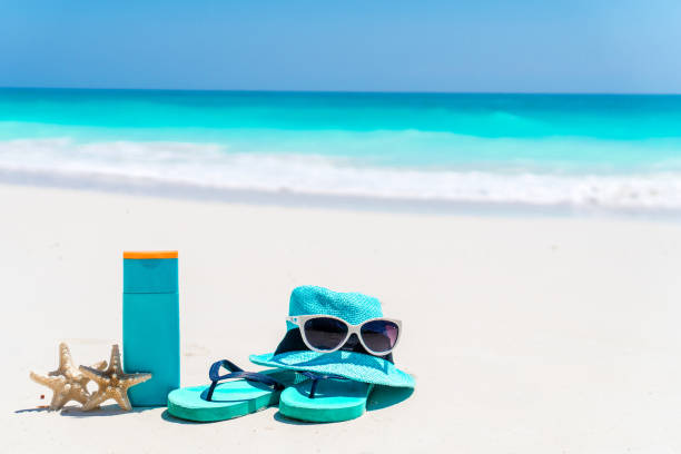 istock suntan lotion bottles and starfish at the beach 1200583532