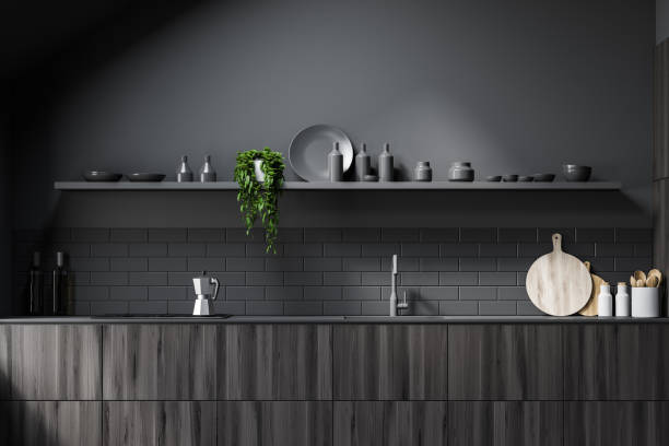 istock Gray attic kitchen with wooden countertops 1200584415