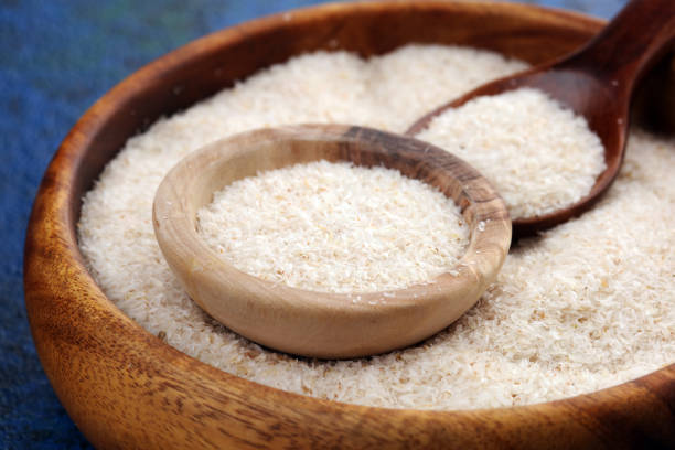 istock Portion of Psyllium Seeds on rustic dark background. Psyllium seed husks on wood 1200584456