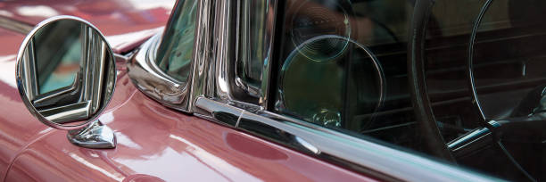 istock vintage pink car with a round mirror 1200586073