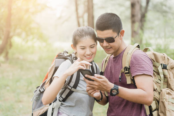 istock Tourists and couples are watching their smartphone screens. 1200587200