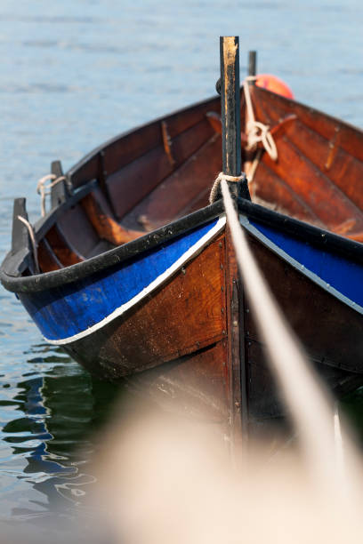 istock Moored wooden rowboat 1200590159