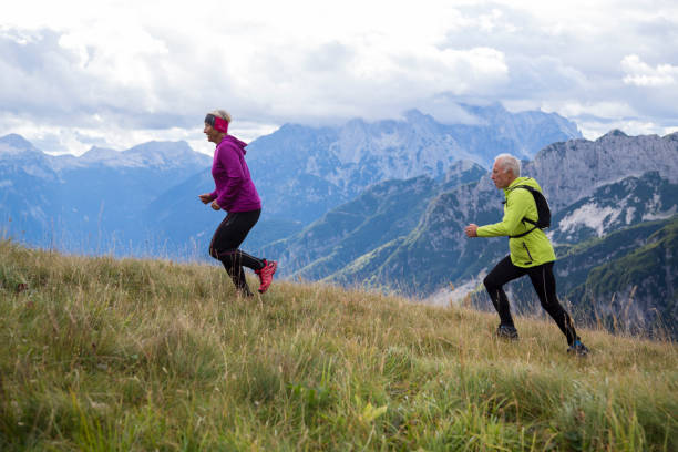 istock Seniors running in the mountains 1200590339