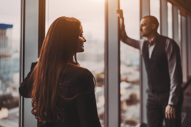istock Two business partners near a window 1200590566