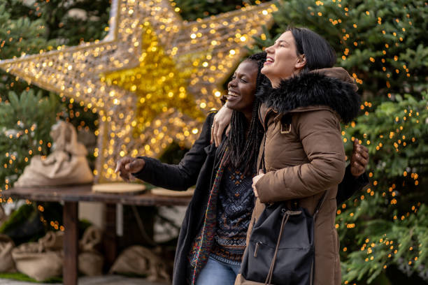 istock Two friends on Christmas market 1200592816
