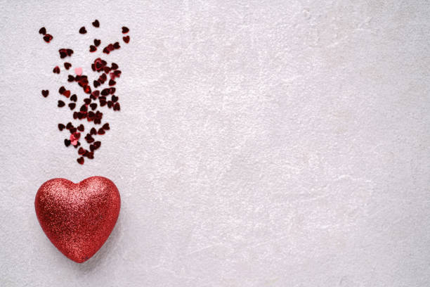 istock Creative greeting card with red heart decorations 1200594138