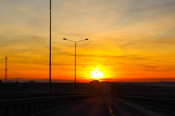 istock beautiful sunset and dawn on the road in summer 1200596053