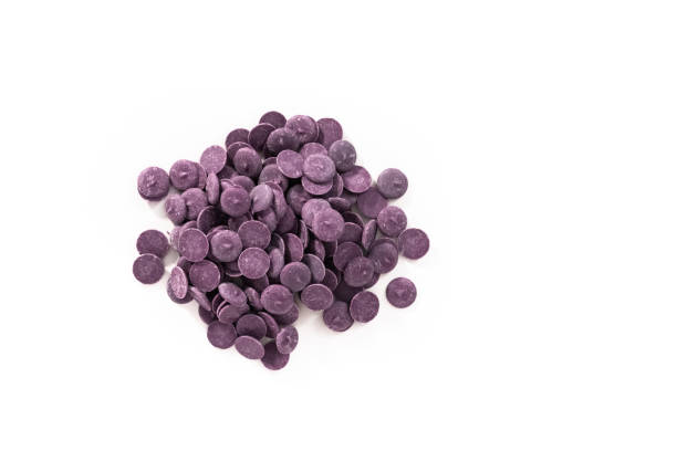 istock Purple round chocolate chips for melting chocolate shapes 1200597176