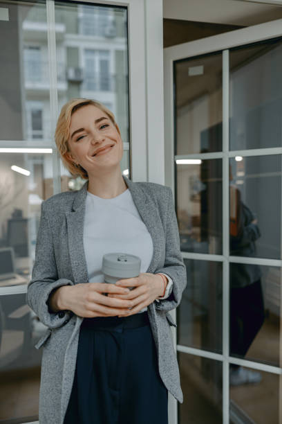 istock Happy pretty female resting with hot drink 1200599373