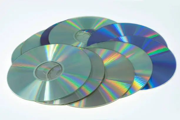 Shot on the old CD and DVD discs on a white background.