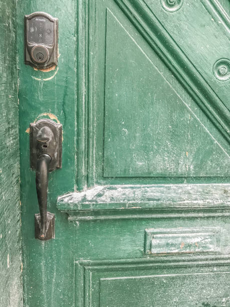istock Antique Doorknob With Green Door 1200602691