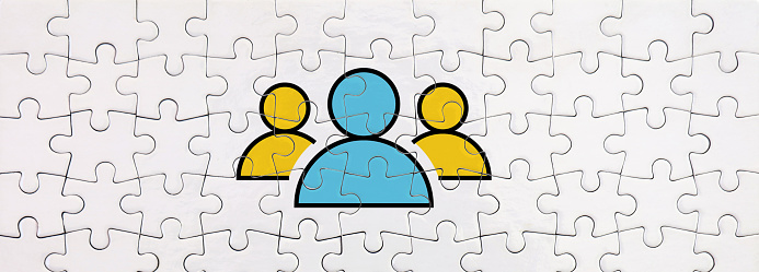 Leadership Concept. People icon on jigsaw puzzle