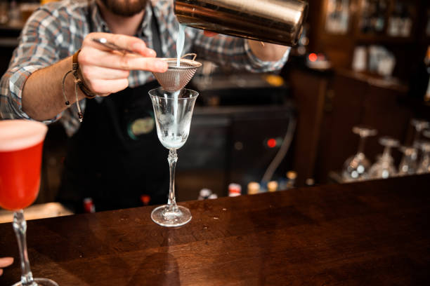 istock Cropped photo of barman using a sieve and shaker 1200606747