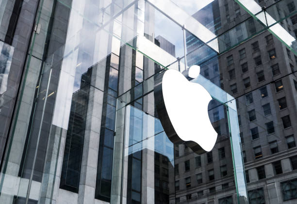 Apple store at 5th Ave in Manhattan, NYC New York, United States - May 19, 2016: Glass building of the Apple Store with huge Apple Logo at 5th Avenue near Central Park. The store is designed as the exterior glass box above the underground display room apple computers photos stock pictures, royalty-free photos & images