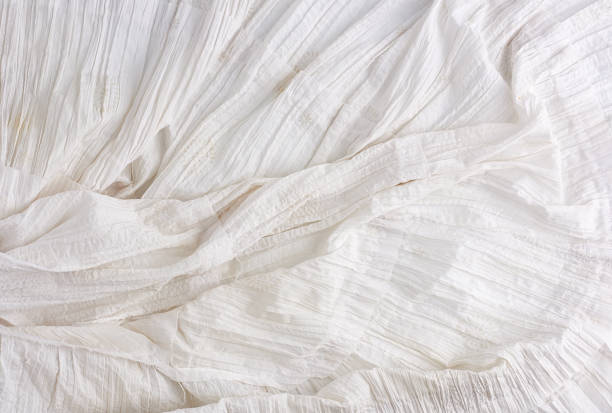 istock crumpled white cotton fabric, fabric for sewing clothes and shirts 1200607739