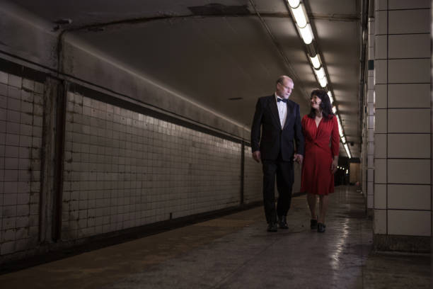 istock Elegant couple walking on subway station 1200608885