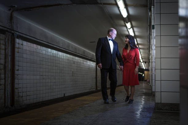 istock Elegant couple walking on subway station 1200608960