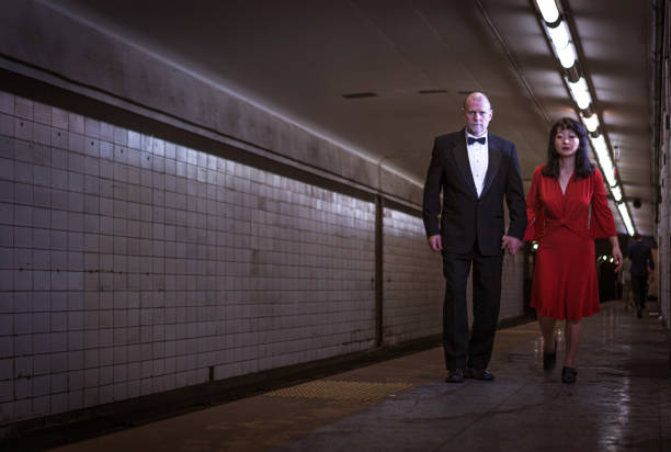 istock Elegant couple walking on subway station 1200609008