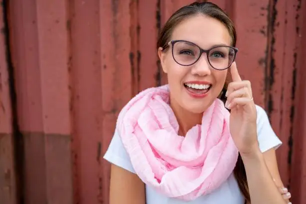 Headshoot of Gorgeous Young Woman with Eyeglasses Smiling - Stock Photo