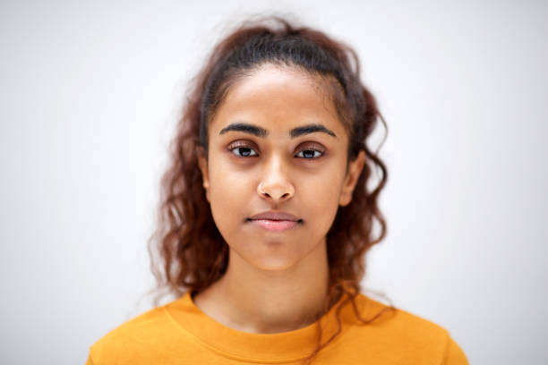 istock Close up horizontal front of attractive young indian woman with serious expression on face 1200610231