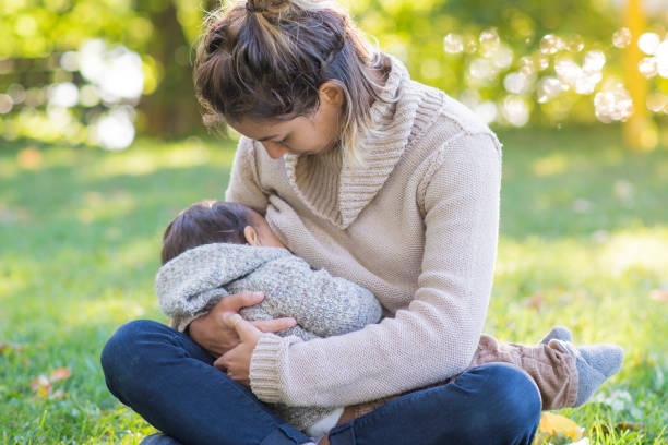 istock Breastfeeding at the Park 1200610427