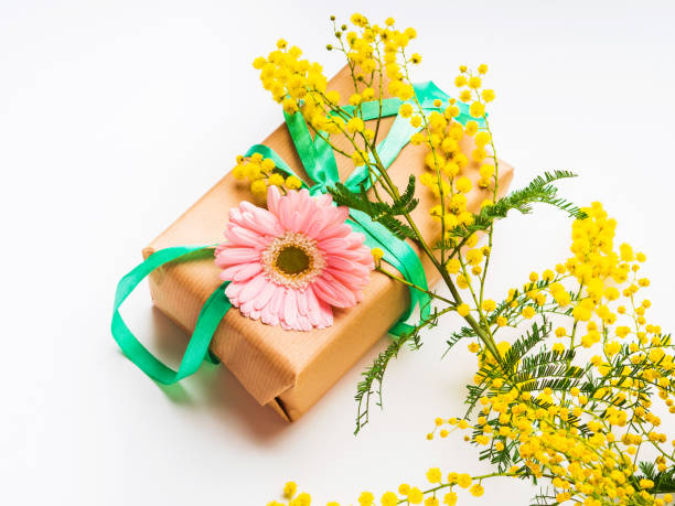 istock Womans day. Gift box with mimosa flowers 1200610586