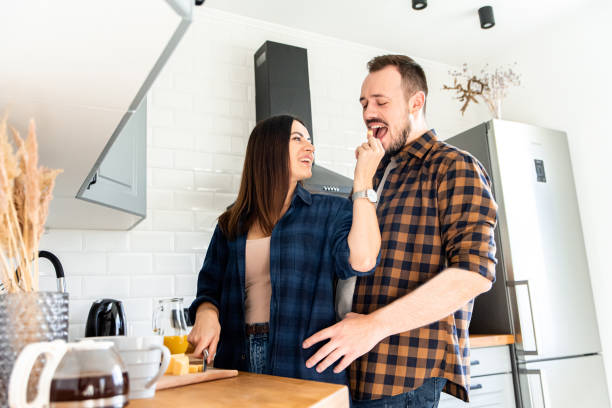 istock Caucasian couple in the kitchen preparing breakfast 1200610736