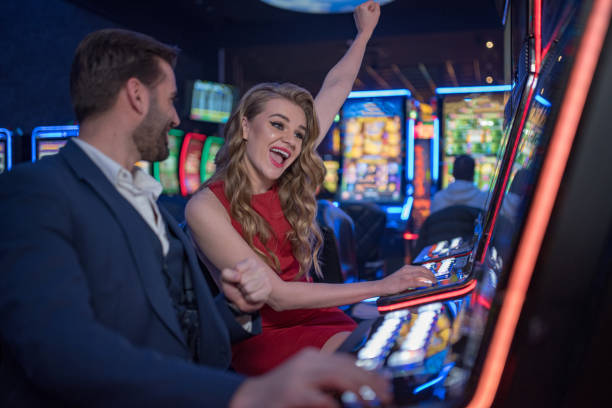 istock couple having fun at casino 1200612408
