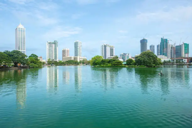 Photo of View of Colombo cityscape reflection on Beira Lake a lake in the center of the city.