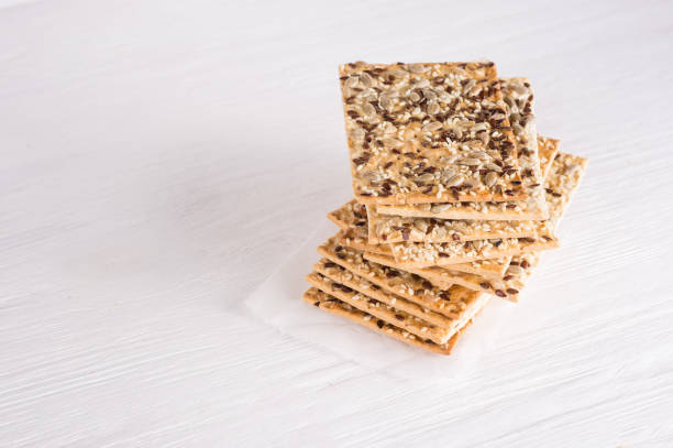 istock Healthy snack: cereal crunchy multigrain cereal flax seed, sesame, sunflower seeds protein bread bar. Protein albumin source. vegetarian food, eco food concepts 1200633448