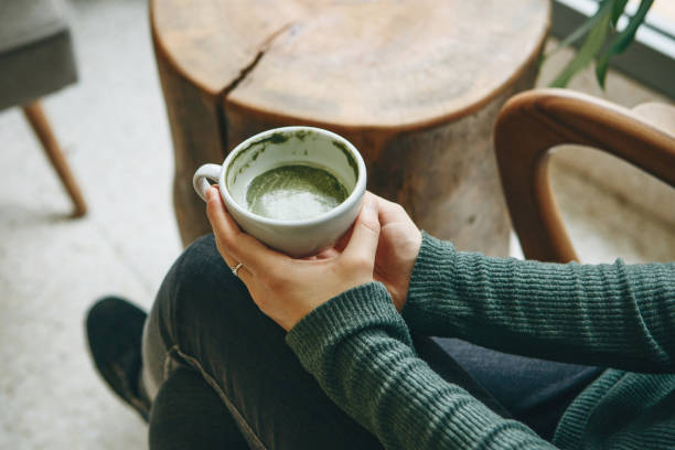 istock Girl drinks matcha latte tea 1200637306