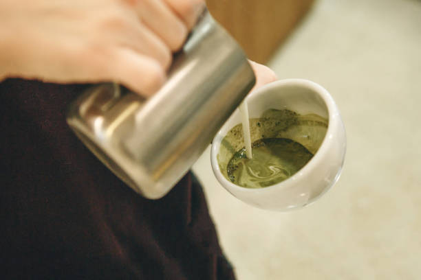 Barista prepares matcha latte tea