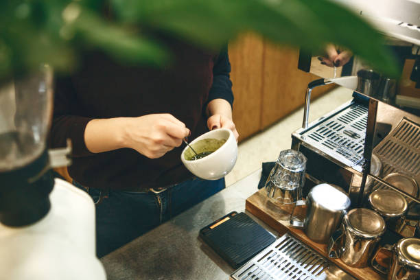 Barista prepares matcha latte tea