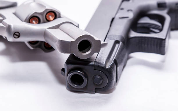 istock A stainless 357 magnum revolver with a black 9mm pistol 1200638461