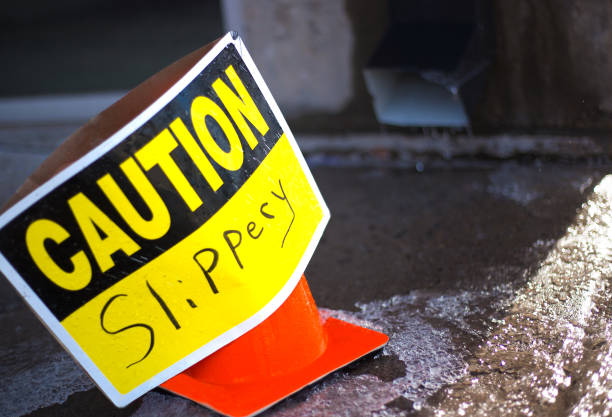 istock CAUTION SLIPPERY Sign on Wet/Icy Pavement 1200638732
