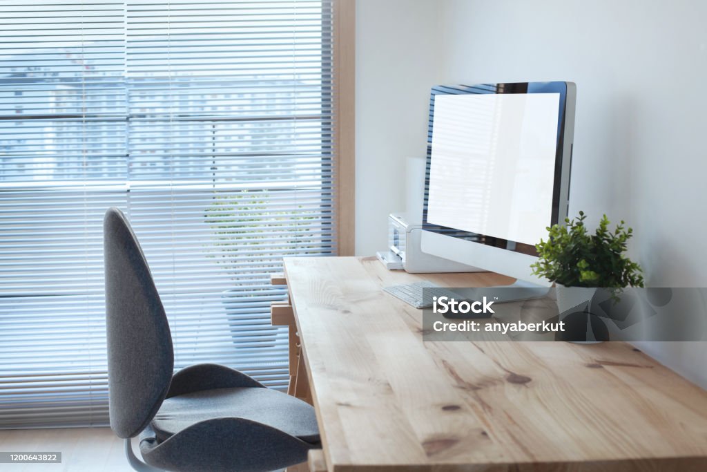 workspace interior with computer on wooden table and office chair workspace interior with computer on wooden table and office chair, modern workplace Desk Stock Photo