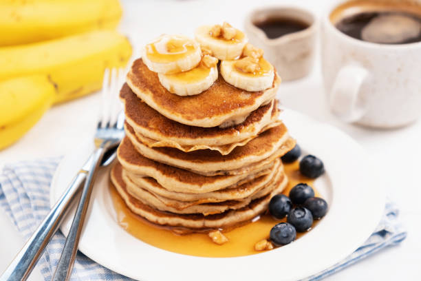 istock Pancakes with banana and golden maple syrup 1200644620