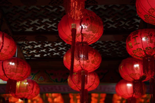 istock Many illuminated red Chinese lanterns with some Chinese characters on it 1200644677