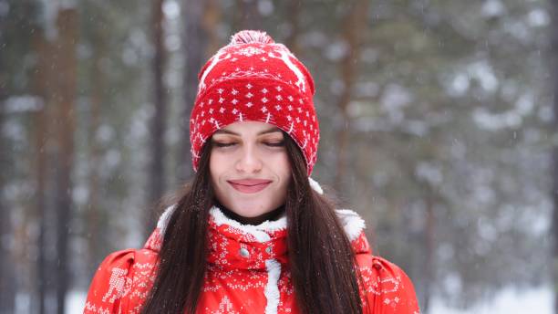 istock Girl playing with snow in park 1200648038