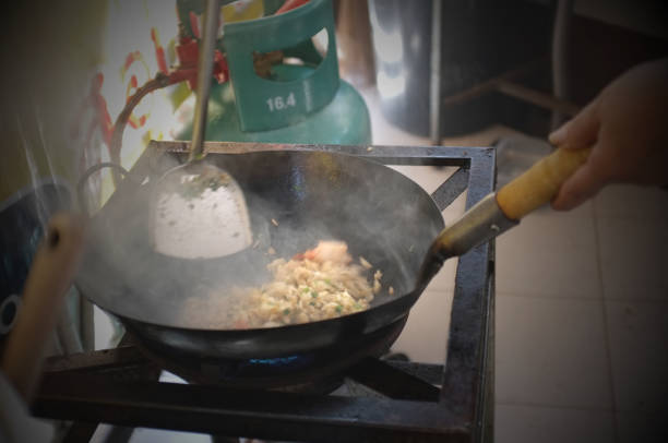 istock The woman cooking Thai fried rice with prawns 1200648877