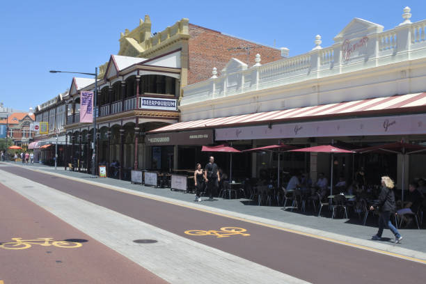 Fremantle, Western Australia - November 27 2019: Pedestirans walk beside historical buildings in Fremantle. Fremantle known for its maritime history, Victorian architecture and remnants from Australia's days as a British penal colony.