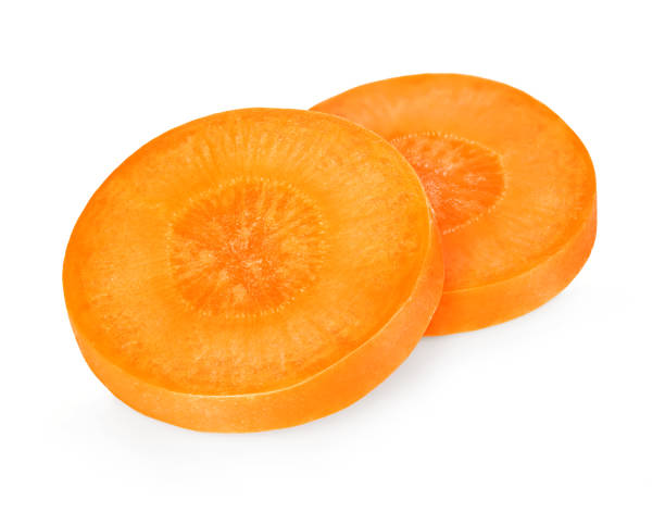 istock Carrot slices  isolated close-up on white background. 1200657867