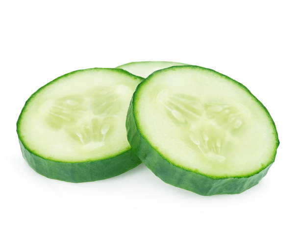 istock Fresh slices cucumber close-up on white background. 1200657868