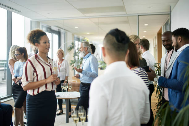 istock Diverse Group of Work Colleagues Enjoying Office Party 1200658851