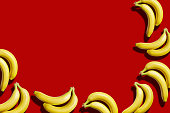 Pairs of bananas or red background