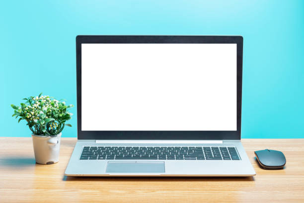 istock Modern laptop with white blank screen on wooden table, front view close-up 1200661993