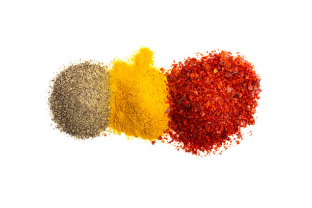 istock Ground red and black pepper and turmeric isolated on white background, top view. 1200661998