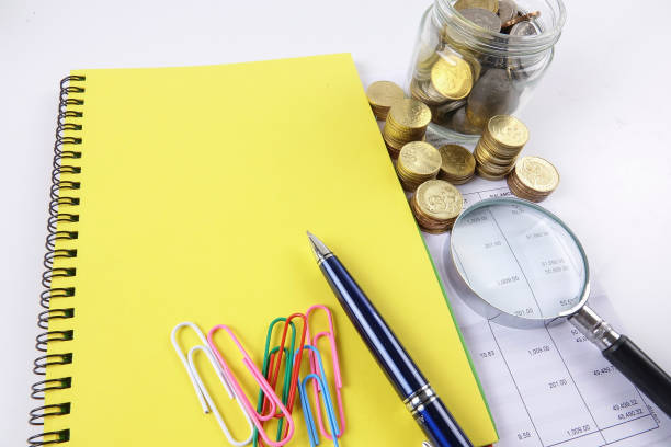 istock Magnify glass,coins and calculator. Business concept. 1200663446