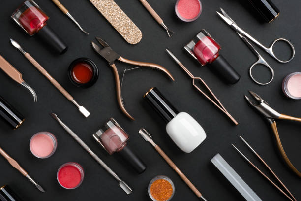 istock Manicure or pedicure tools and cosmetics isolated on dark background 1200664441
